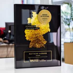 6mm clear acrylic with UV printed map. Gold metal with laminate imitation of brushed gold. Painted edges and black UV print.