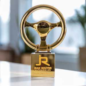 3D printed and metallised steering wheel with a stone cube created with sandblasting, painting and metallised